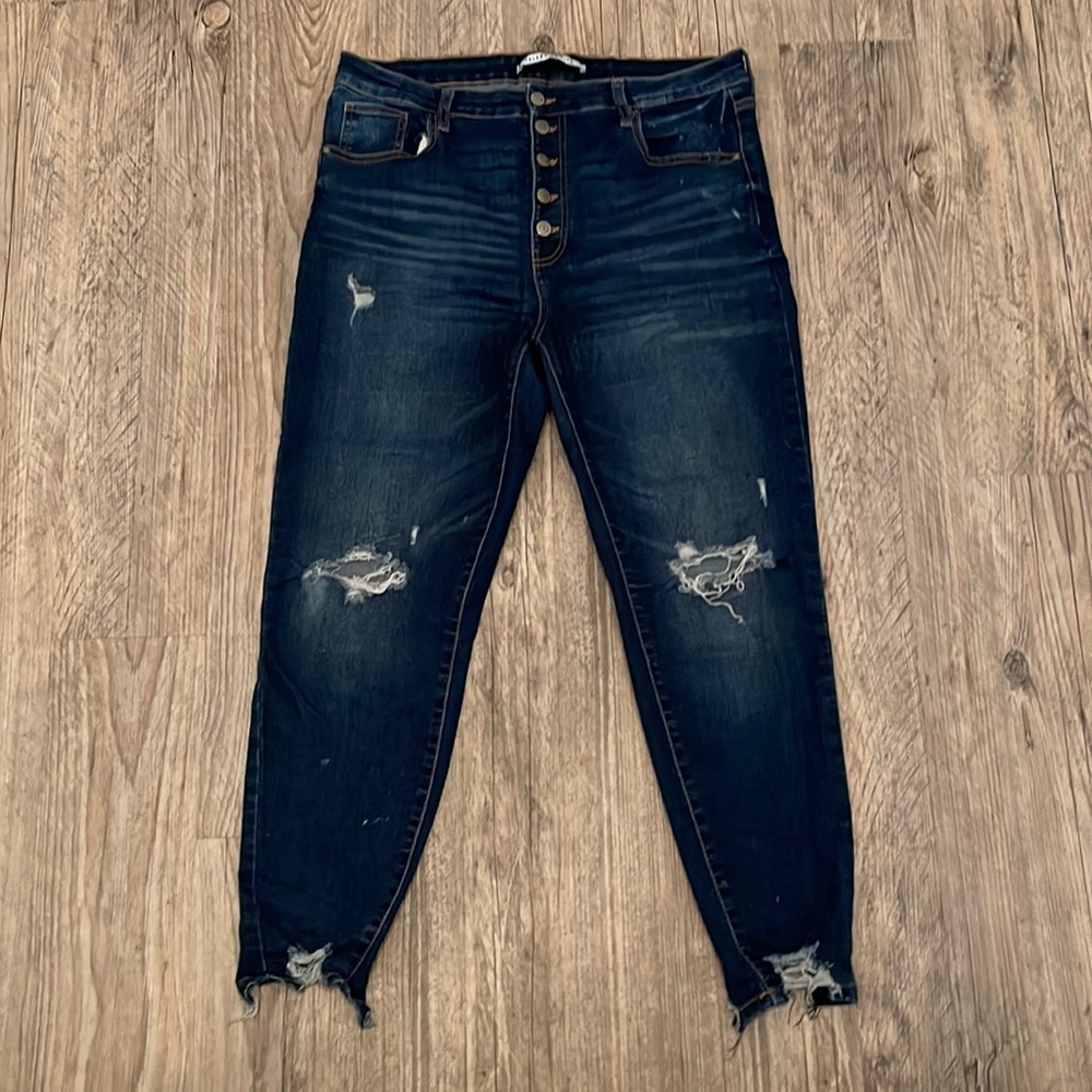 Dark blue distressed jeans
